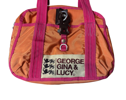 Orange and pink bag with 'George Gina & Lucy' label on a white background