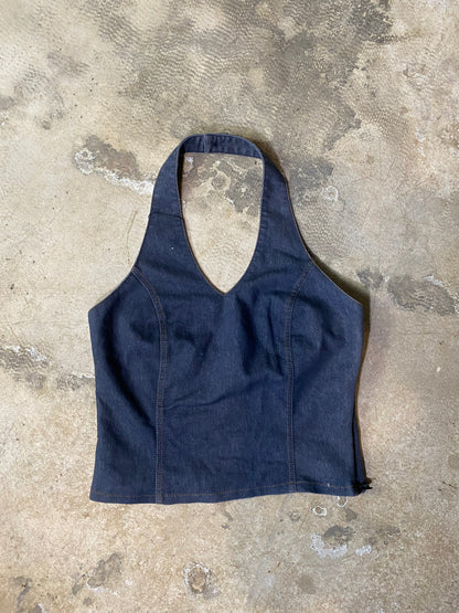 Blue denim apron on a concrete surface