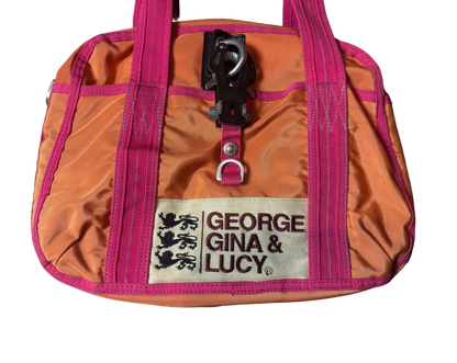 Orange and pink bag with 'George Gina & Lucy' label on a white background